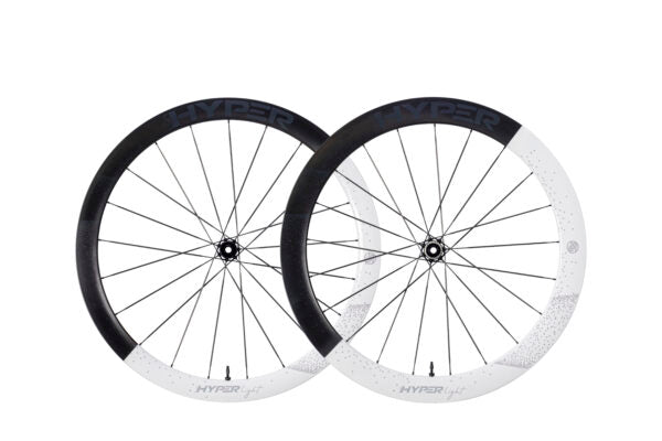 Pair of Lún HYPER LIGHT carbon fiber deep-section wheels with gray HYPER branding on black and white finishes.