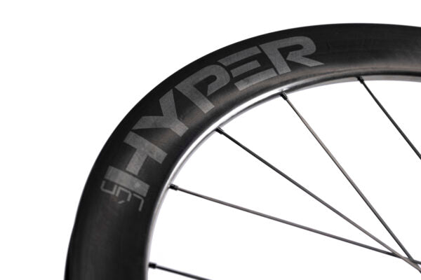 Lún HYPER LIGHT carbon wheel with debossed dark gray HYPER branding.